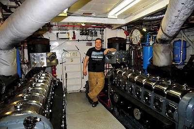 Chief Engineer Frank Crowther in the engine room of the MV Uchuck III.