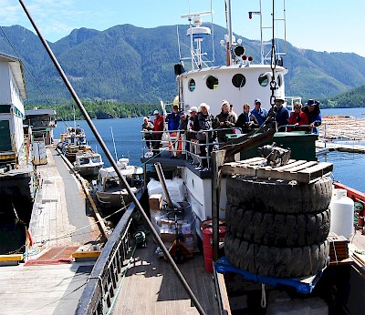 Passengers watch from the safety of the upper deck as the Mv Uchuck III crew deftly offload freight to a remote salmon fishing lodge in Nootka Sound.